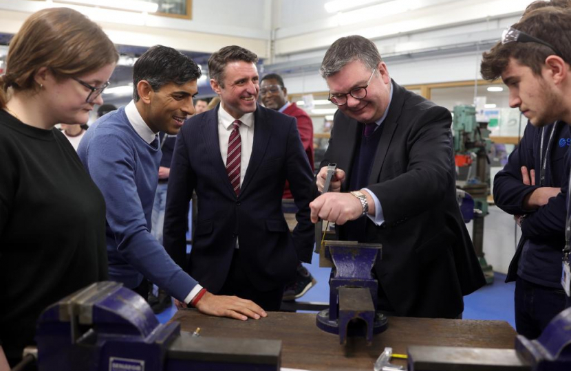 Iain and Rishi with local apprentices