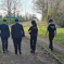 Iain walking with police officers